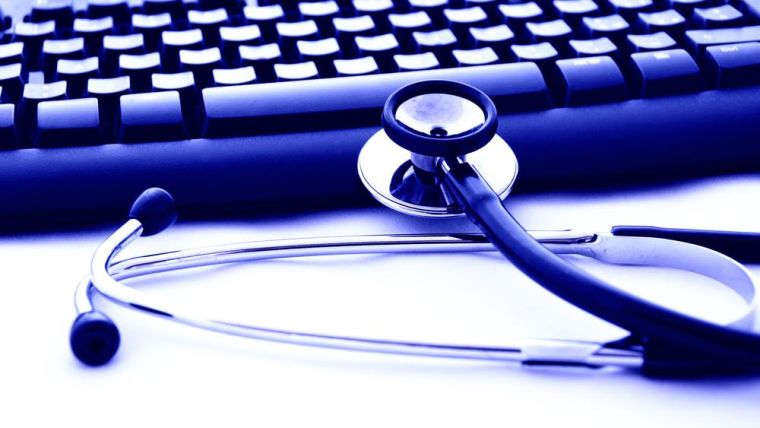 A blue keyboard and a doctor's stethoscope